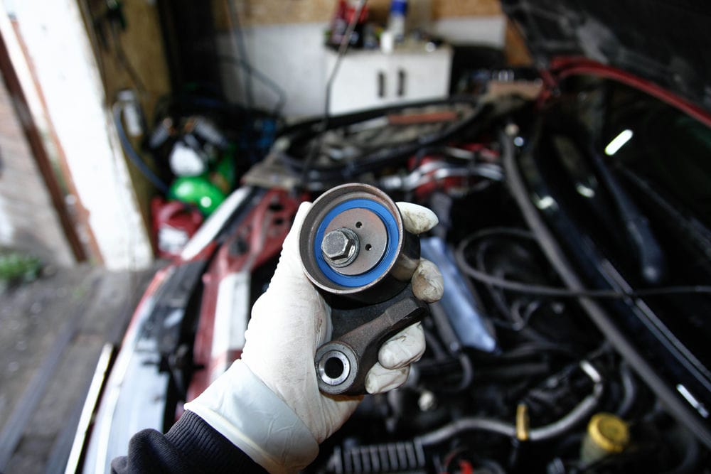 Timing belt tensioner